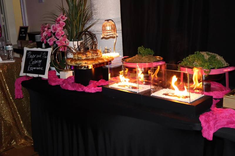Flavor and Flair Catering Fire & Flair signature buffet with dramatic tabletop fire elements and premium presentation