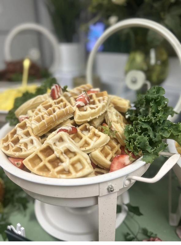 Flavor and Flair Catering Golden Waffles: Golden waffles served with fresh strawberries and delicious toppings, creating a sweet and satisfying brunch favorite.