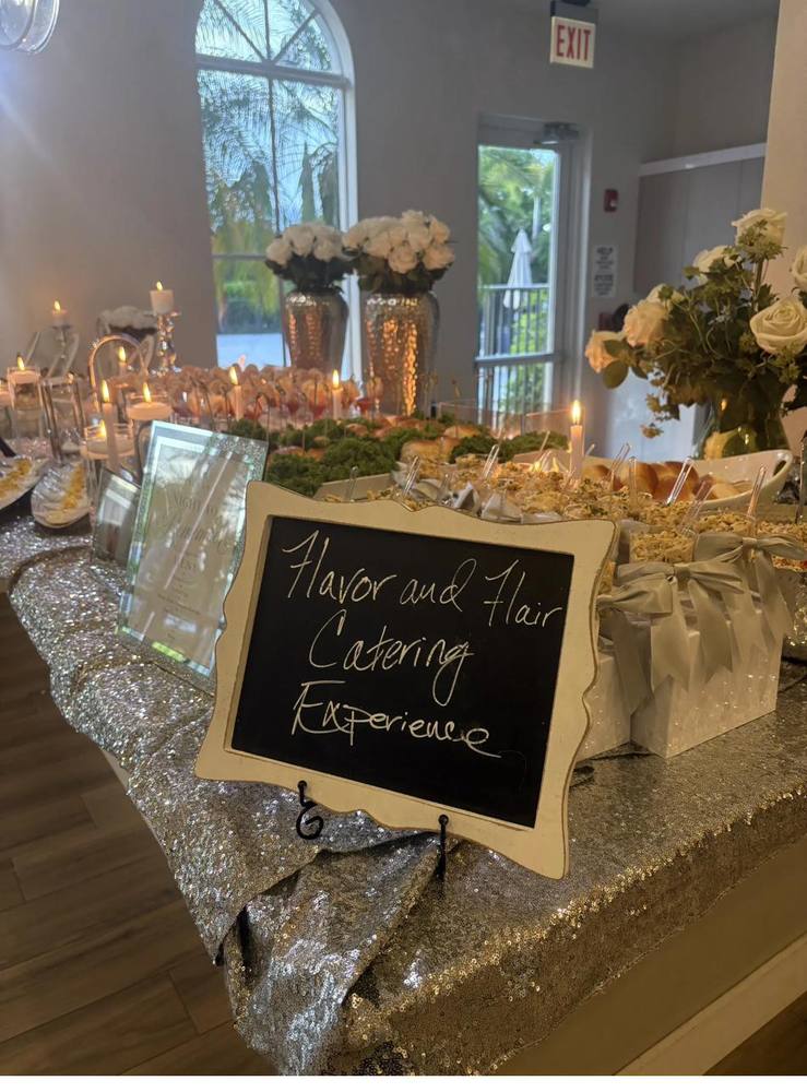 Flavor and Flair Catering Silver Elegance tablescape with shimmering linens, candlelight, and fresh florals